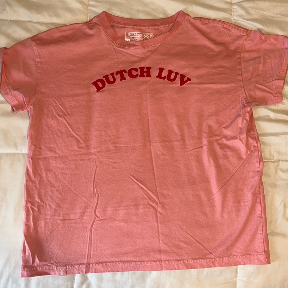 Dutch Bros pink shirt sleeve